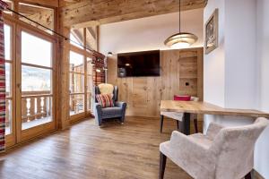 a dining room with a table and two chairs at Ferienhaus Magdalena in Mittenwald