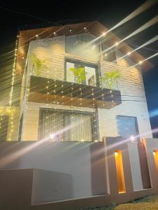 a building with plants on the side of it at Lux Bliss Bed & Breakfast in Amritsar