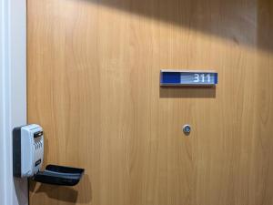 a sign on a door that says on it at Le Jourdain in Paris