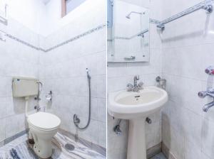 a bathroom with a toilet and a sink at Hotel New Mamta in Srinagar