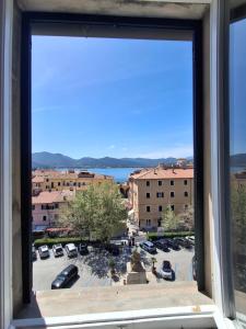 a view from a window of a parking lot at Casa Azzurra in Portoferraio