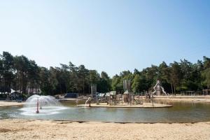 a park with a water park with a playground at Camping Siesta in Lille +13 photos