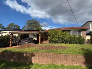 a house with a car parked in the driveway at Bright Double Room N Winston Hills in Toongabbie +1 photo