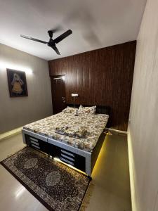 a bedroom with a bed in a room at Kavya royal in Mathura