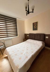 a bedroom with a bed and a window at Casa Ramona en Foz in Foz