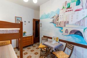 a bedroom with a bed and a painting on the wall at CristallPont AmalfiDay in Atrani +51 photos