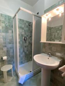 a bathroom with a shower and a sink at Locanda Cà de Rusitta in Vezzi Portio