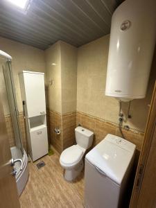 a bathroom with a toilet and a shower and a sink at Mercury Apartments Budva in Budva +32 photos
