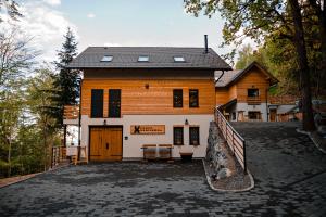 a house with a slide in front of it at Posest Kunigunda in Šmartno v Rožni Dolini