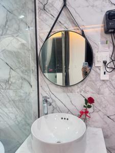 a bathroom with a white sink and a mirror at Soha Hotel Cần Thơ in Cái Răng +48 photos