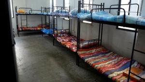 a group of bunk beds in a room at Shivashrays Homestay in Rānchī
