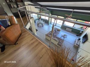 an overhead view of a living room with a couch at Spacieuse villa au calme avec grande piscine in Bormes-les-Mimosas