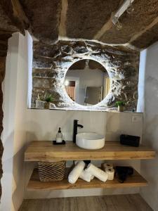 a bathroom with a sink and a mirror at Casa Erundina in Camariñas +41 photos