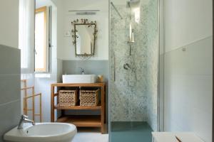 a bathroom with a sink and a shower at Casa La Barancina in Cittiglio +22 photos