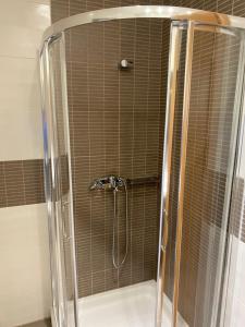 a shower with a glass enclosure in a bathroom at CasaKOS in Kos