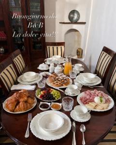 a table with plates of food on it at La dolce vita in Zelbio