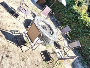 an overhead view of a group of chairs and a grill at Таки Дача на Фонтане in Odesa