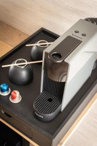 a electronic device sitting on top of a table at Villa Pal'Ange Hotelservice Playstation 5 Billiard in Durbuy