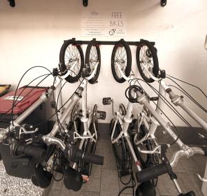 a group of bikes parked next to a wall at Kalasó Design Guest House - Rome Airport in Fiumicino