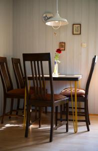 a dining room table and chairs with a vase on it at auf der Muehle zwei in Zerbst +11 photos