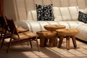 a living room with wooden tables and a couch at Alai Crete, a Tribute Portfolio Resort in Stalís