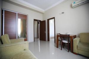 a living room with a couch and a table at Green House Hotel N2 in Kobuleti