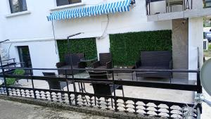 a balcony with chairs and plants on a building at ВЛАД ДОМ Студио in Vratsa