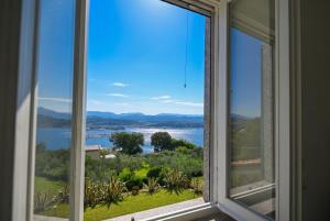 a window with a view of the water at Il Collina - Poets'Vista in La Spezia