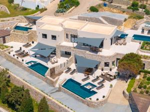 an aerial view of a house with a swimming pool at Pnoe Villas Syros in Megas Gialos - Nites