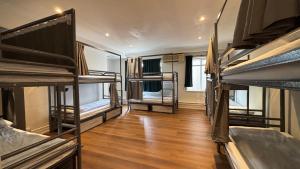 a room with a bunch of bunk beds at The Dawson Hostel - DUBLIN in Dublin