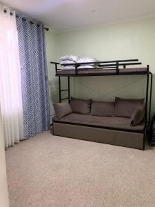 a room with two bunk beds in a room at Rest House in Cholpon-Ata