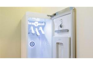 a refrigerator with its door open in a room at 엠플레이스호텔 in Incheon +44 photos