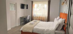 a bedroom with a bed and a table and a window at Belvedere Panaci in Coverca +13 photos