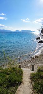 a path leading to a beach with the ocean at Salt and Sun in Nikiana