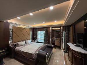 a bedroom with a bed and a sink and a tub at 木木 Lin in Chiayi City