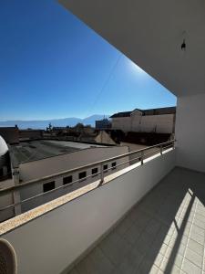 a balcony with a view of a building at InnPogradec Center in Pogradec