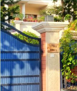 a gate with a sign that reads garage homes at Chinar Homes Amritsar in Amritsar