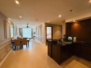 a kitchen and living room with a table and a dining room at Bow Luxury 3 in Danang