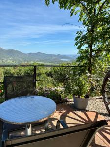 a table and chairs on a patio with a view at U Sognu in Muro
