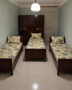 a room with two beds in a room with at Hotel MANTASHOV in Meghri