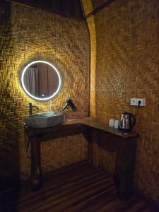 a bathroom with a sink and a mirror at Lombok Rice Terracce Glamping in Tetebatu