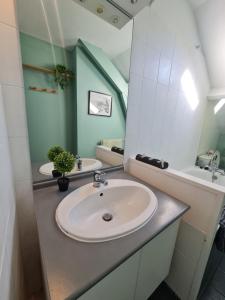 a bathroom with a sink and a mirror at Le Chaudron d'Or - 41m2 - Hyper Centre - Mezzanine - Clim - WIFI HD in Amiens +23 photos