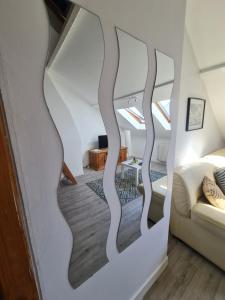 a bedroom with a wall mural of trees at Le Chaudron d'Or - 41m2 - Hyper Centre - Mezzanine - Clim - WIFI HD in Amiens