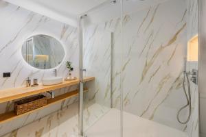 a bathroom with a shower and a mirror at Apartment VistaMar I in Port de Pollensa