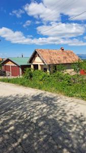 a house sitting on the side of a road at Nature Nest Više Selo in Blace