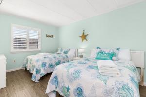 a bedroom with two beds and a window at Late August Labor Day Deals! Ocean Block Sleeps 6 Beach Gear in Ocean City