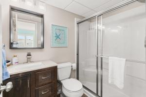 a bathroom with a shower and a toilet and a sink at Late August Labor Day Deals! Ocean Block Sleeps 6 Beach Gear in Ocean City +17 photos