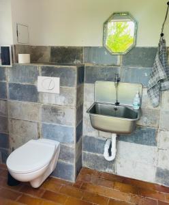 a bathroom with a sink and a toilet at Bauwagen, Tiny House in Warnitz am Oberuckersee in Melzow