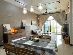 a living room with a table and a couch at Molek Regency Johor Bahru By JC Home in Johor Bahru