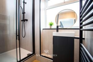 a bathroom with a sink and a mirror at Luxury 6BR Ensuite - Contractors & Groups Stay - Parking in Sunderland